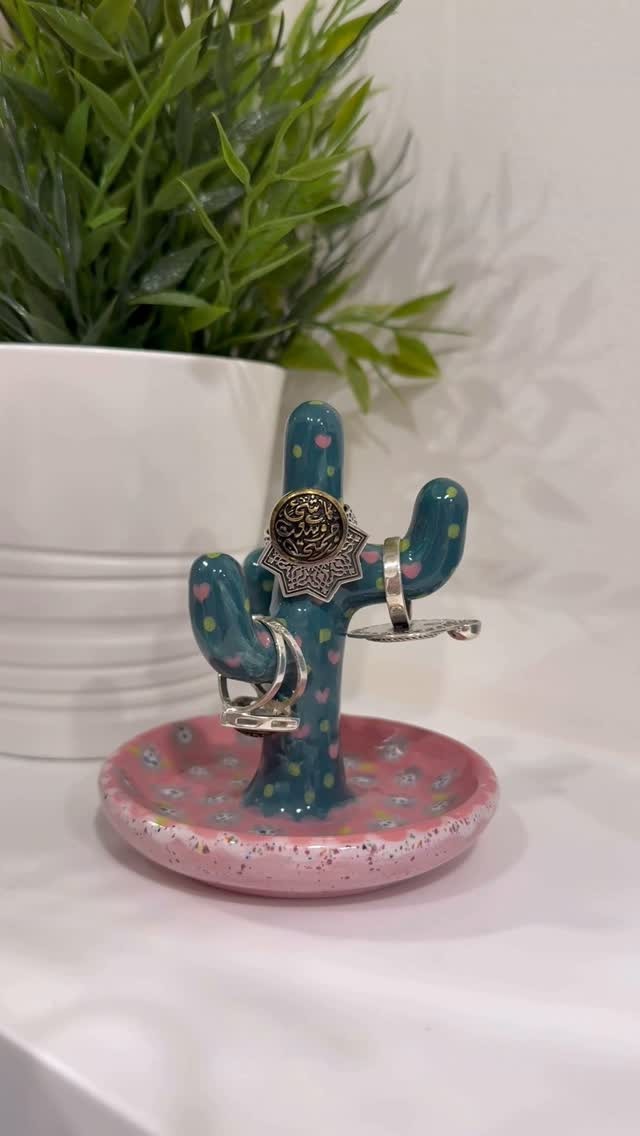 Merit’s painted cactus pottery accessory stand in turquoise, green and pink